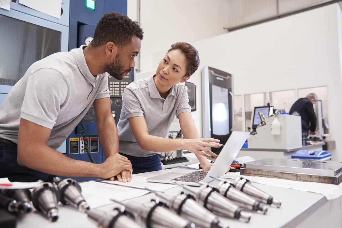 two-engineers-using-cad-programming-software-on-la-2024-10-19-02-55-06-utc-1